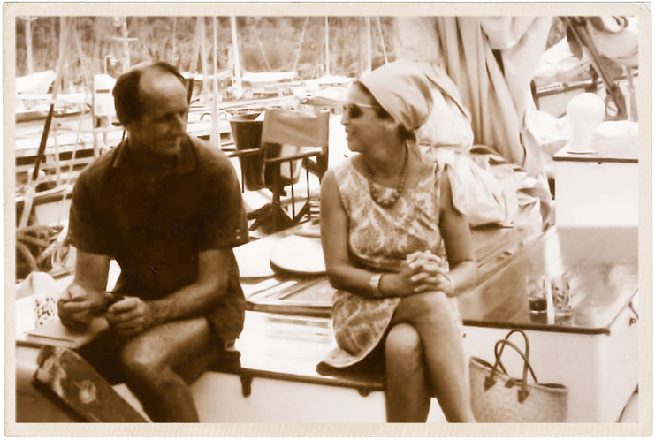 a man and woman sitting on a boat