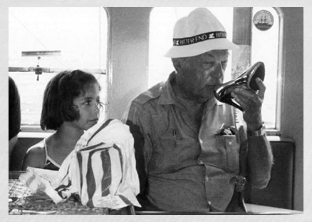 a man and a girl sitting on a train