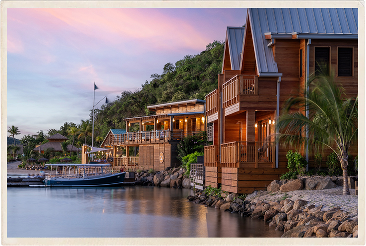 a row of houses next to a body of water