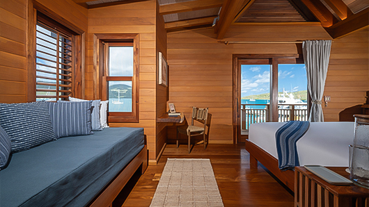 a room with a bed and a chair