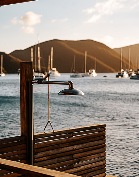 a shower head on a pole with a rope attached to it