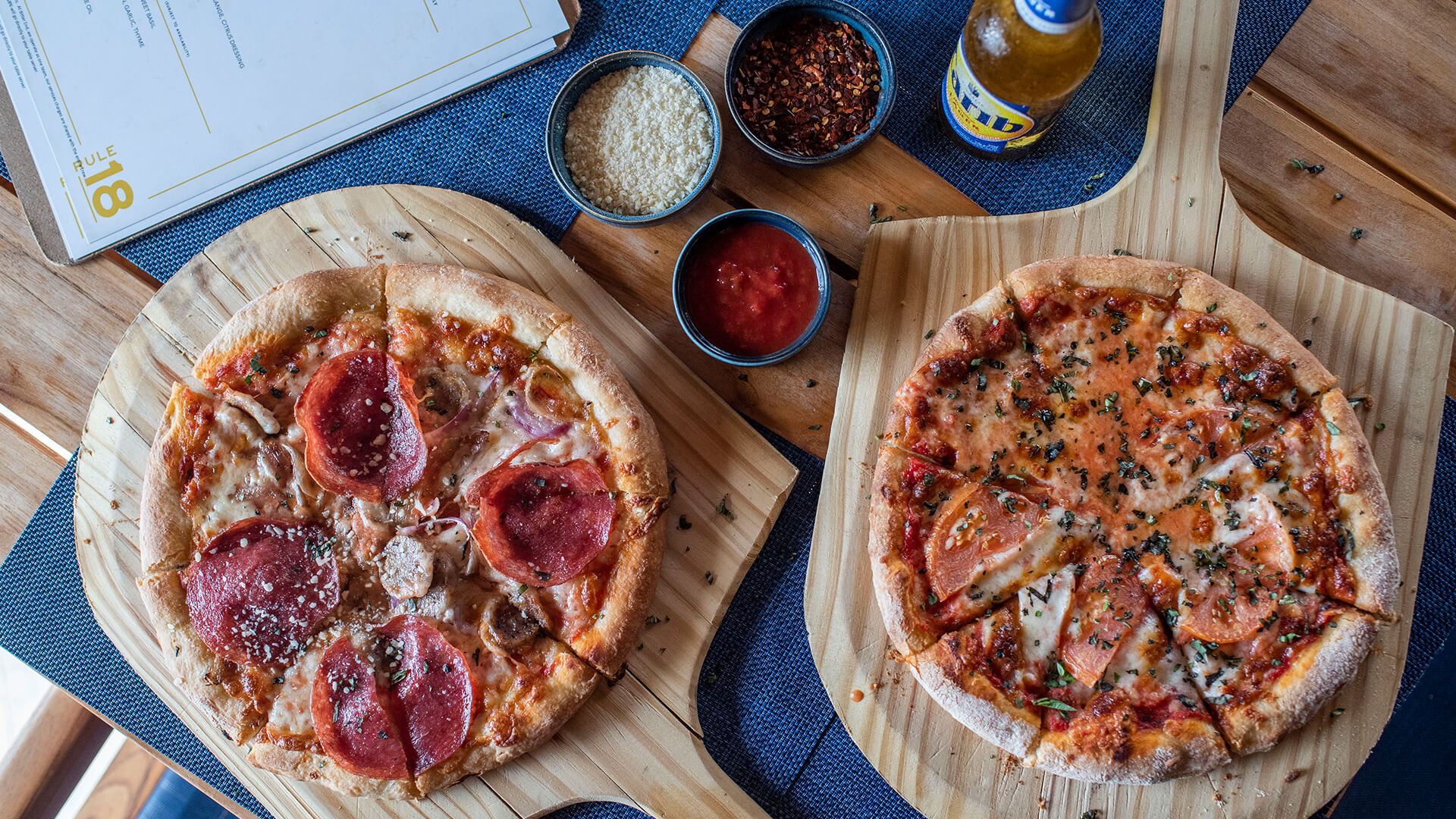 a pizzas on a wooden board