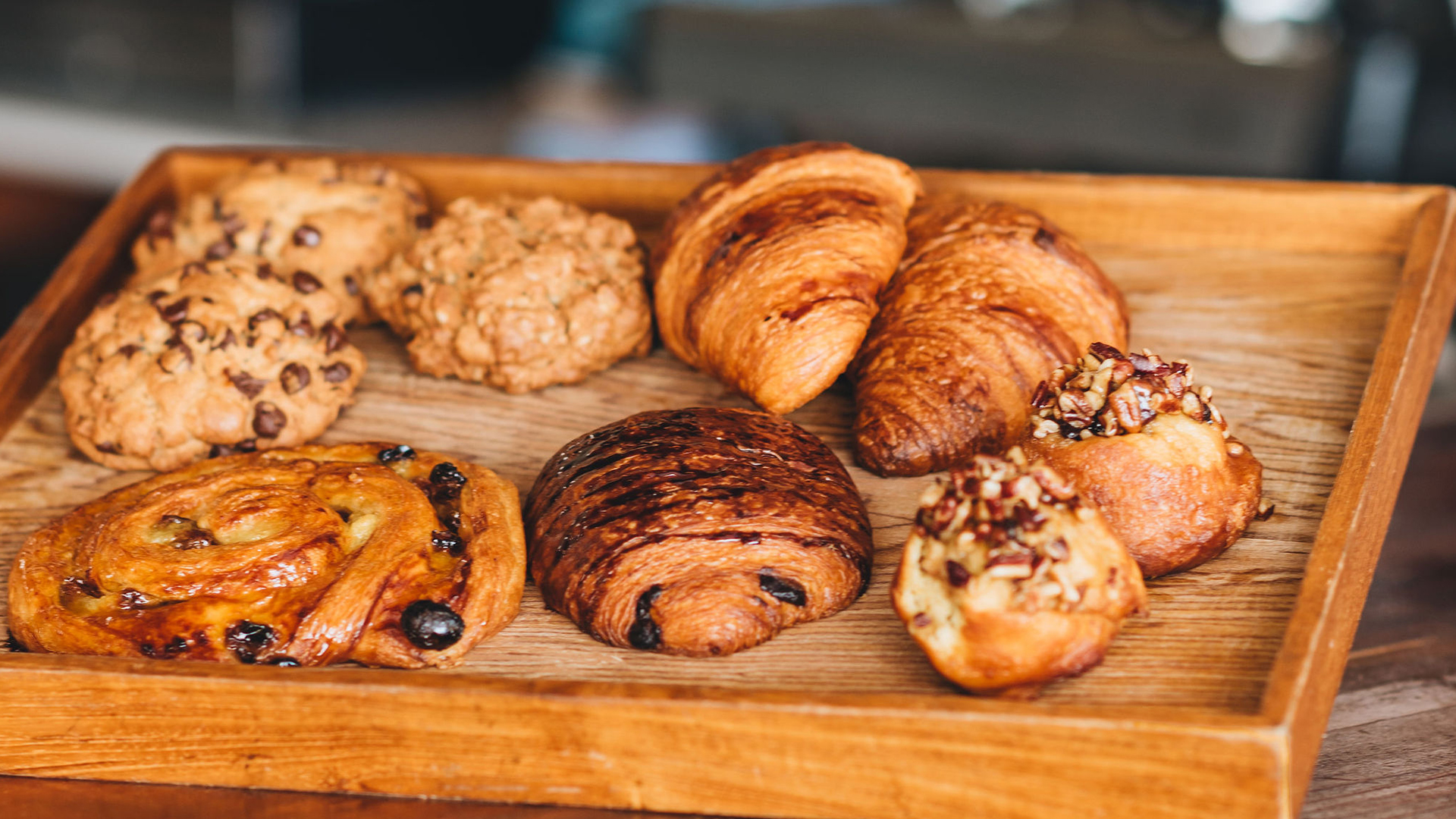 a tray of pastries on a wooden surface