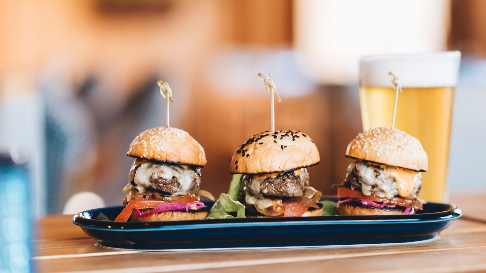 a group of burgers on a plate