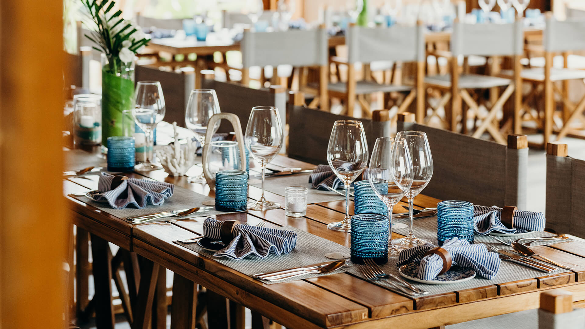 a table with glasses and utensils