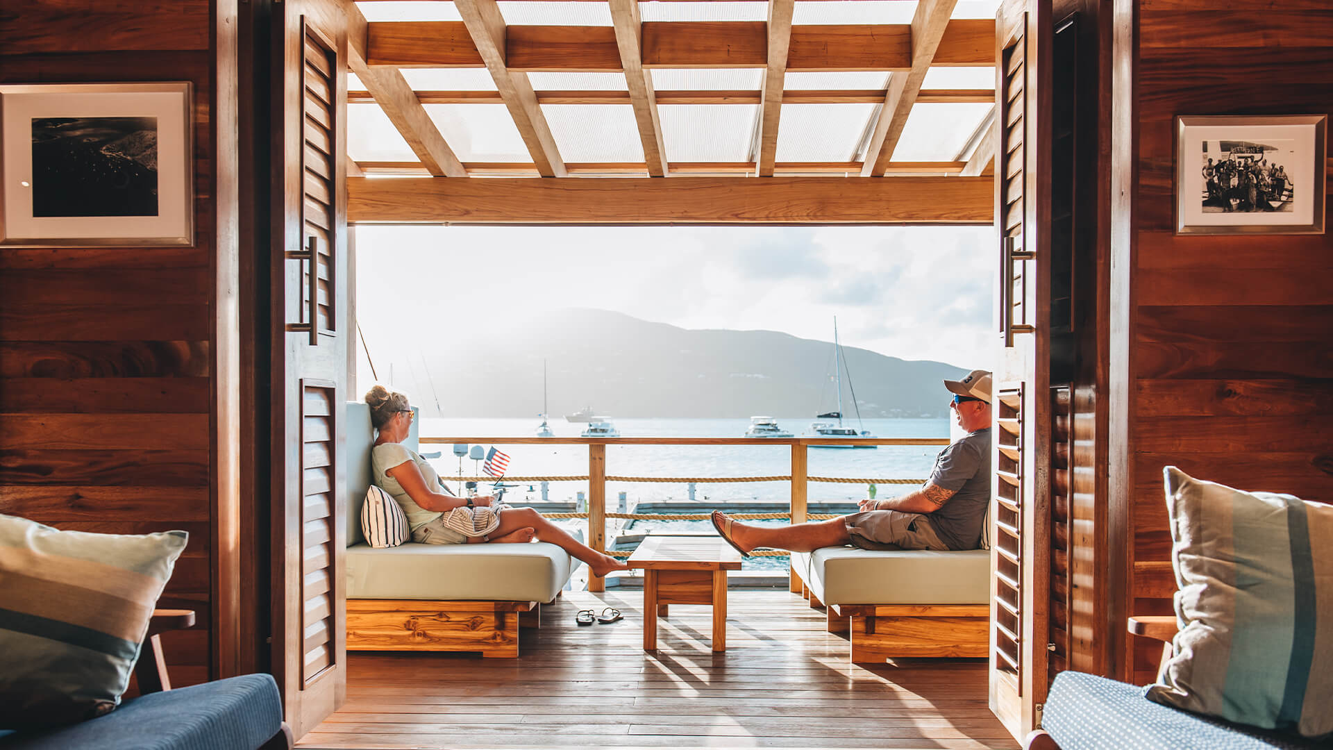 a man and woman sitting on a deck