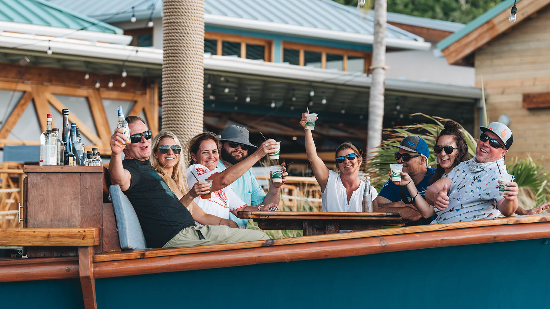 a group of people sitting at a table with drinks