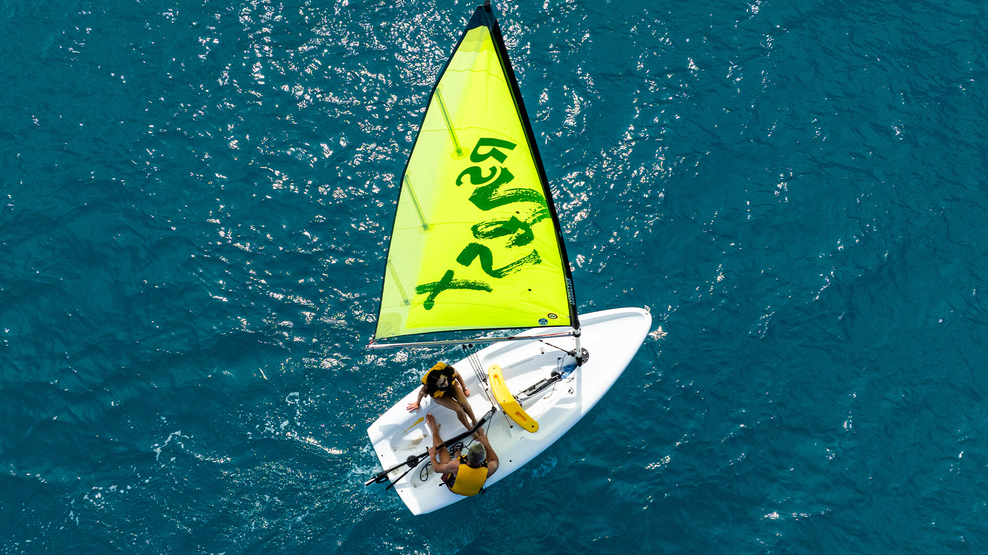 a group of people on a sailboat