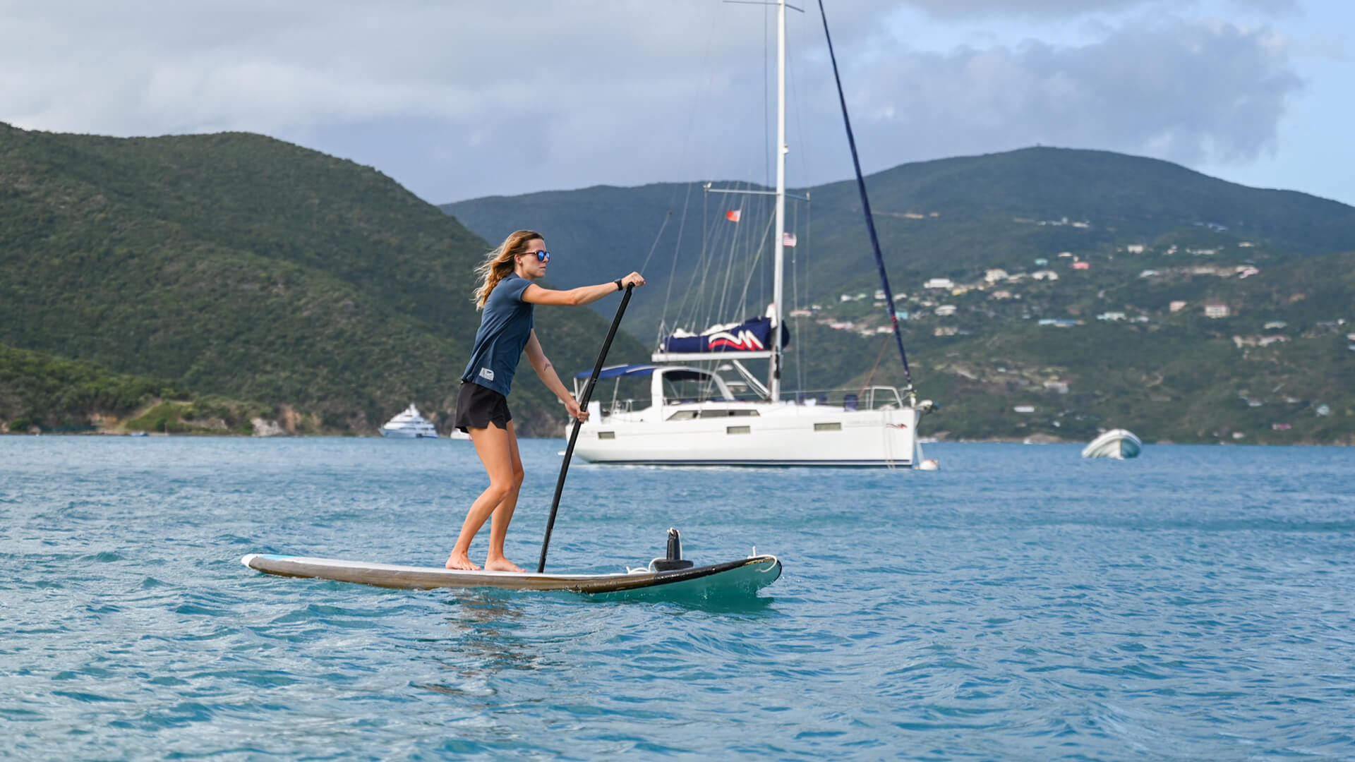 a woman on a paddle board