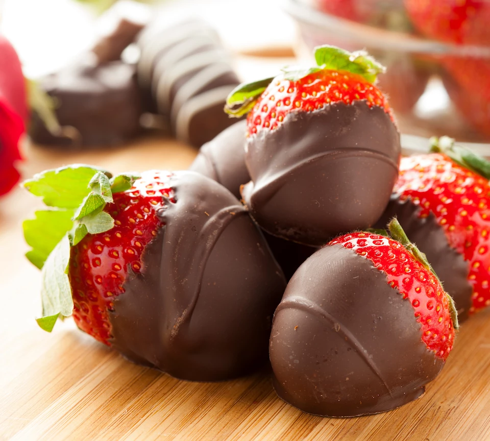 a group of strawberries covered in chocolate