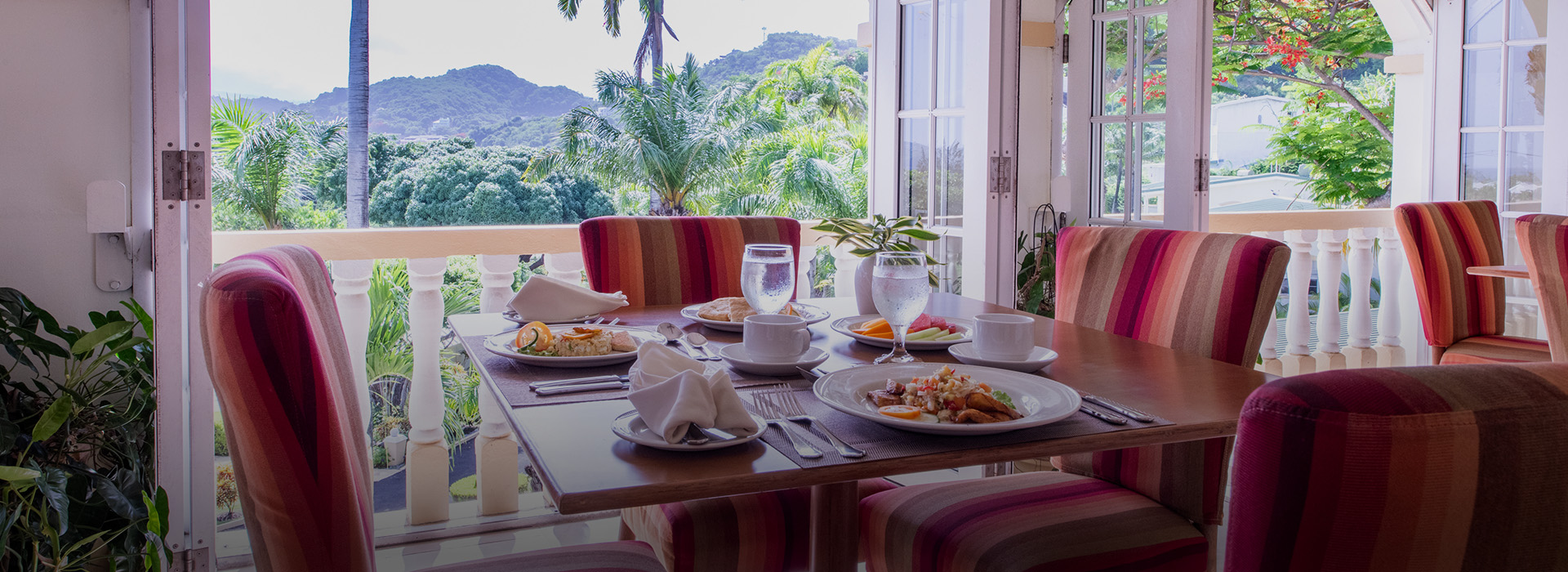 a table with plates of food and glasses on it