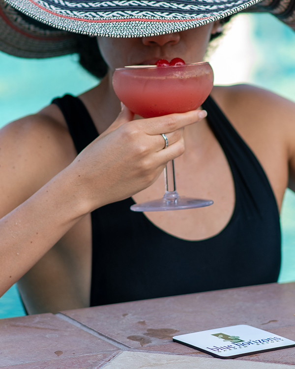 a woman drinking a drink