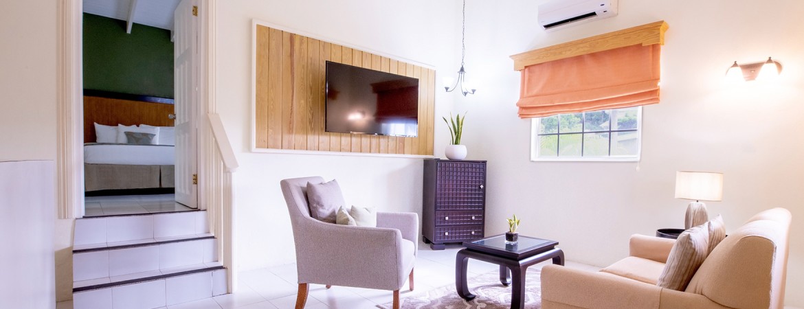 a living room with a television on the wall
