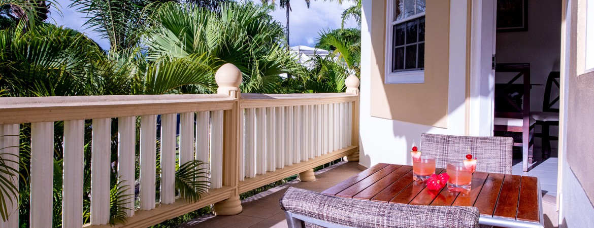 a table and chair on a porch