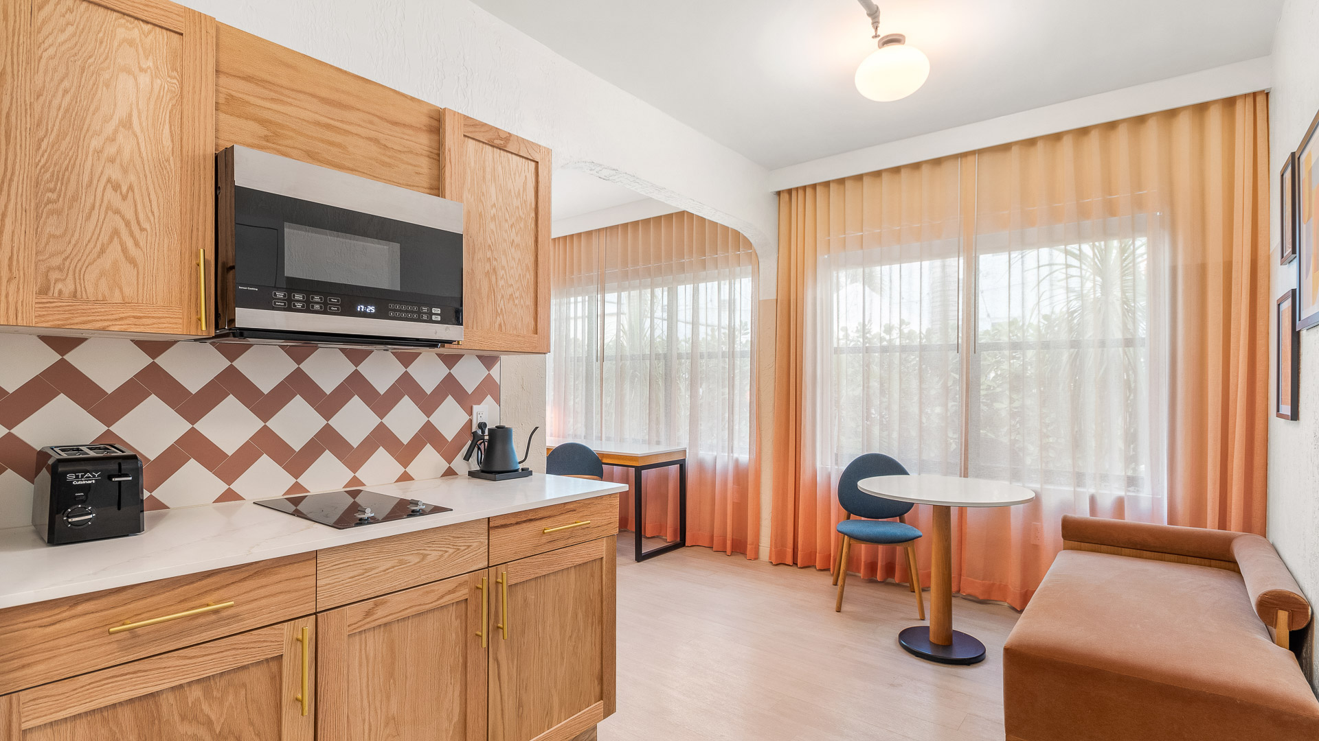 a kitchen with a table and chairs