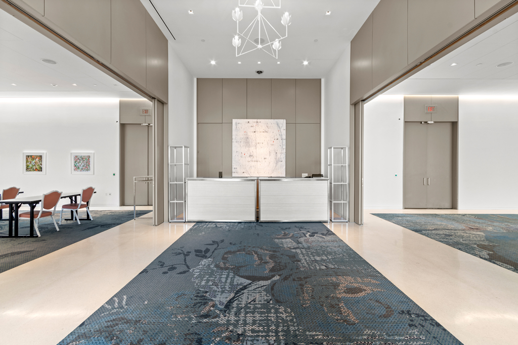 a lobby with a chair and a table