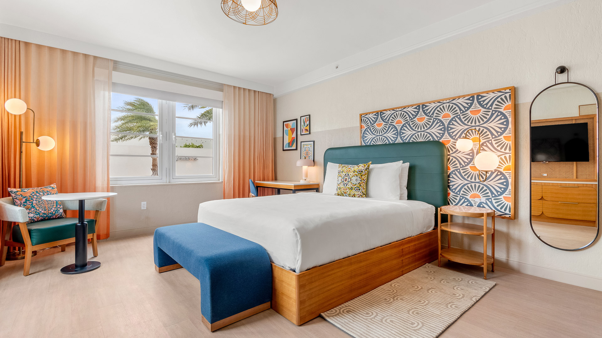 a bedroom with a bed and a bench