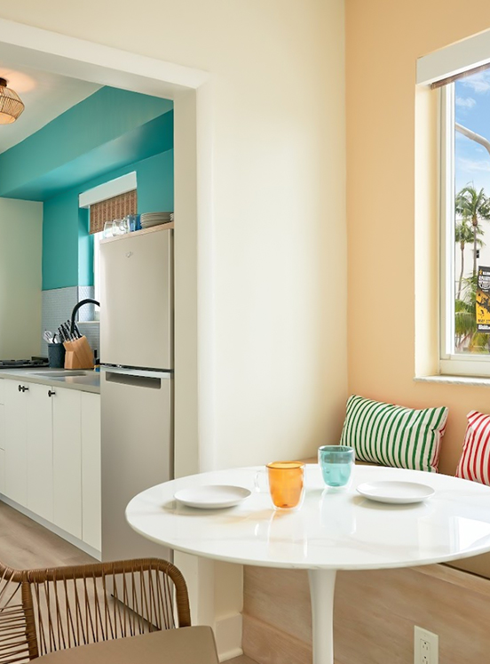 a kitchen with a table and chairs