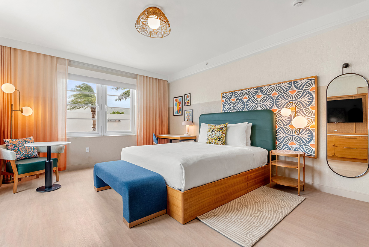 a room with a bed and a desk