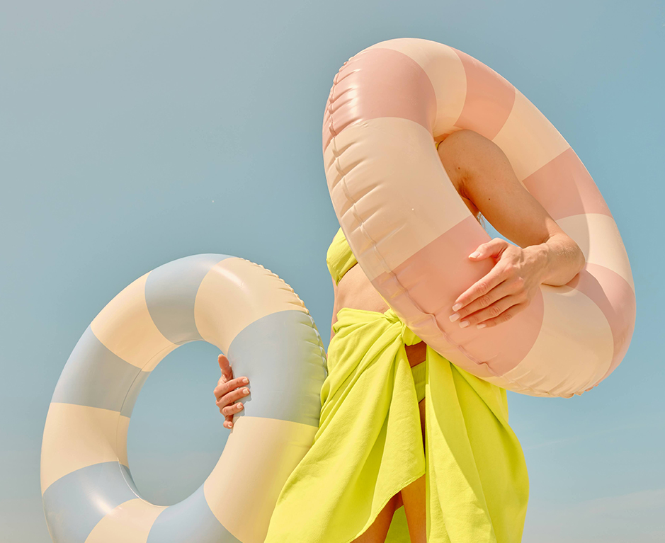 a woman holding a float around her face