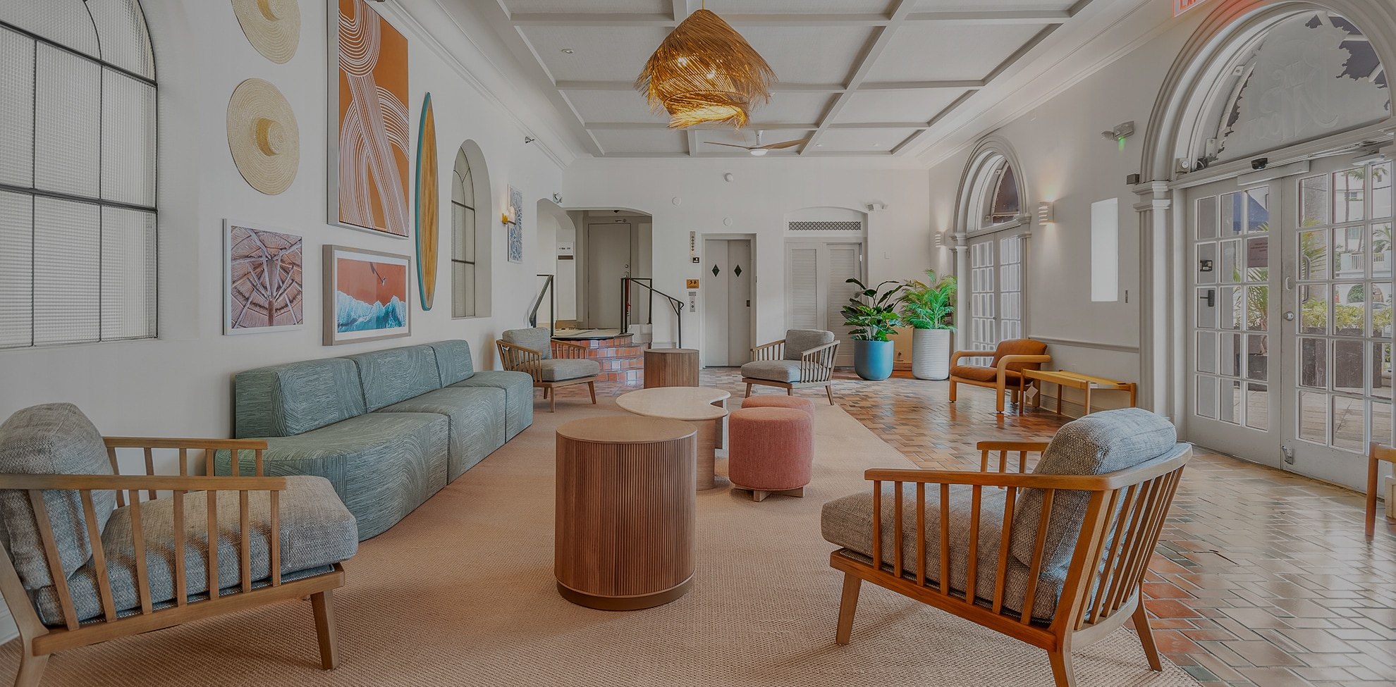 a room with a couch and chairs