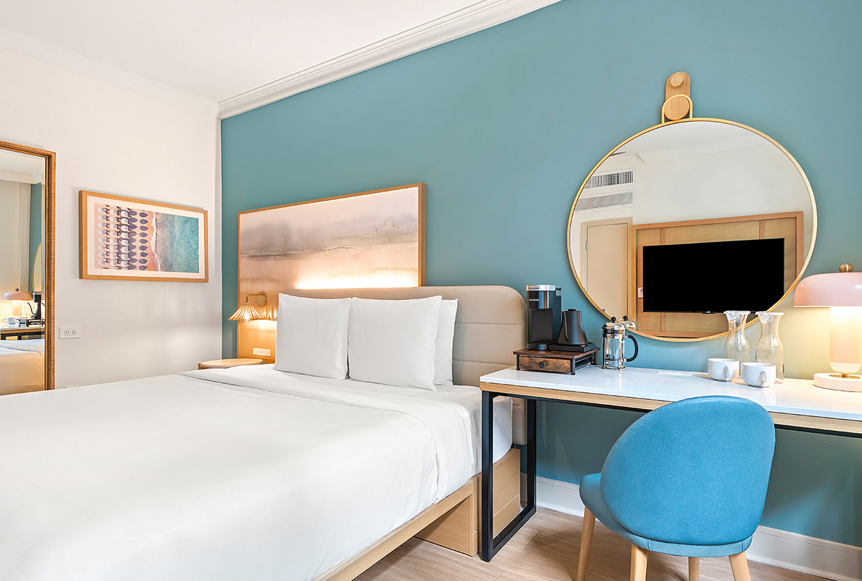 a room with a bed and a mirror