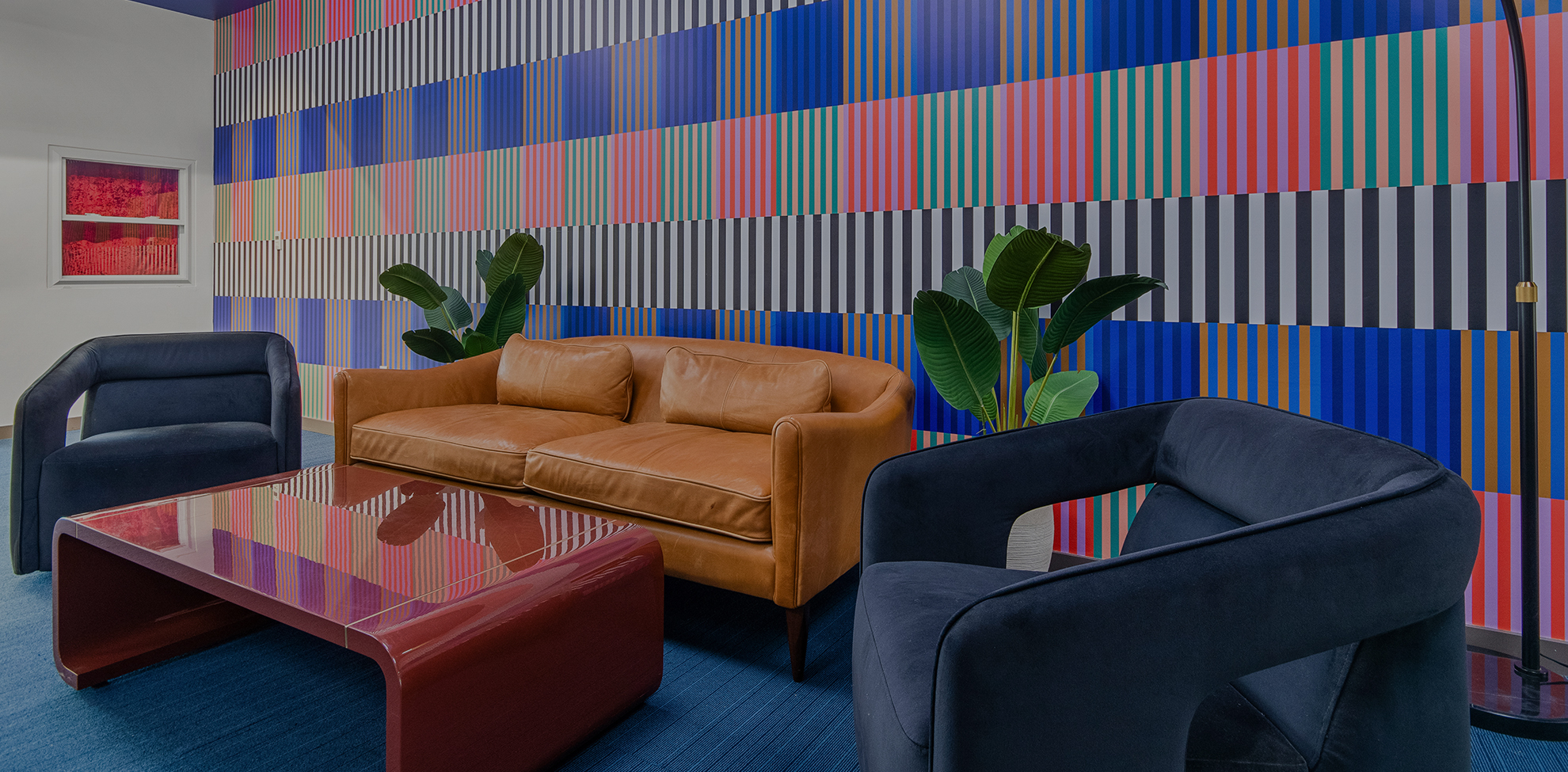 a couches and chairs in a room