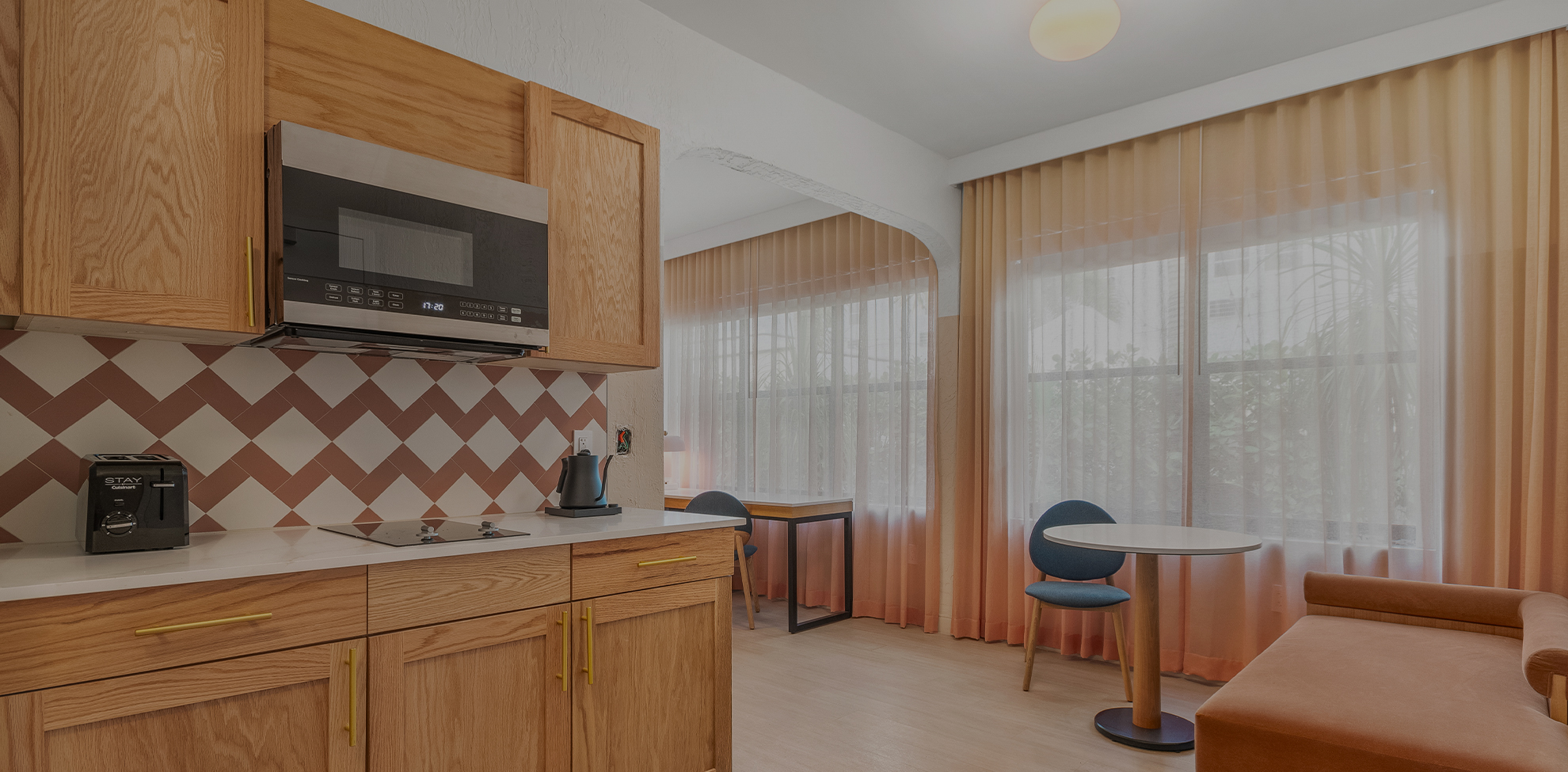 a kitchen with a table and chairs