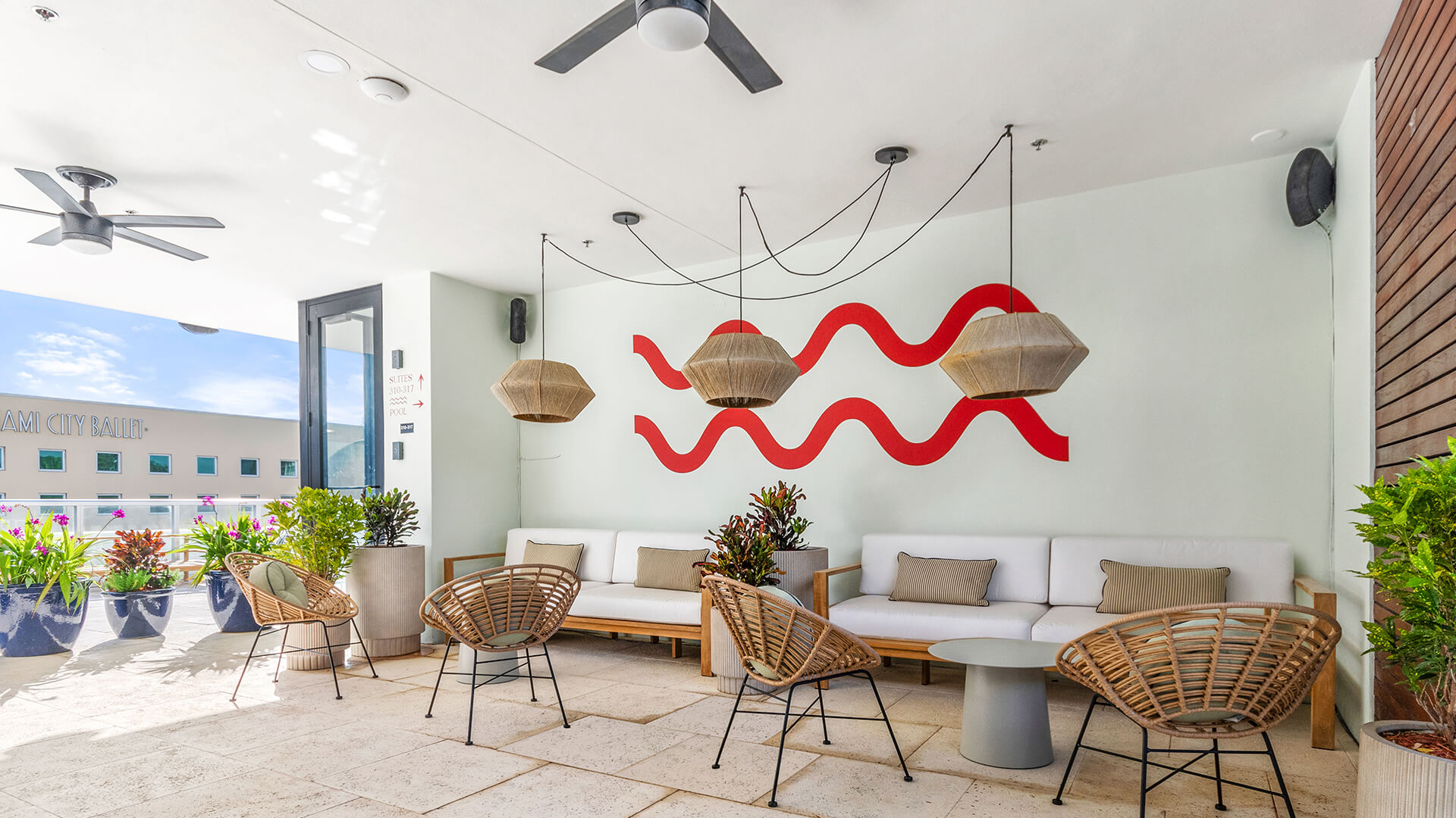 a room with a couch and chairs