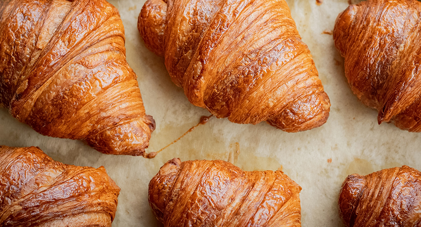 a group of croissants on a paper