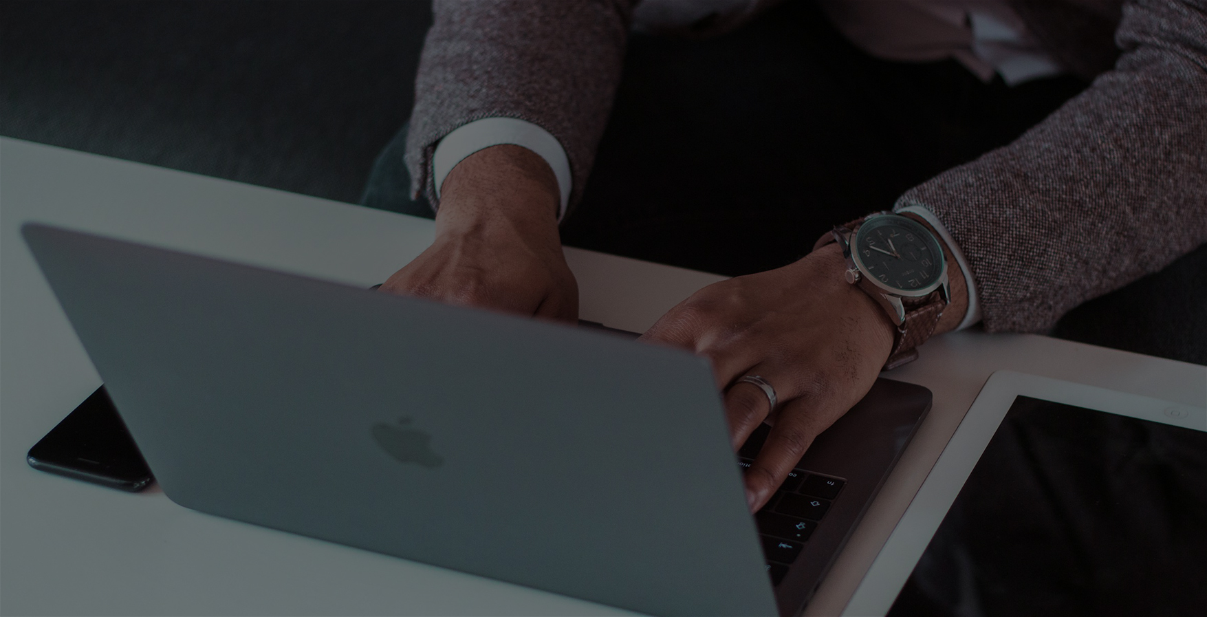 a person typing on a laptop