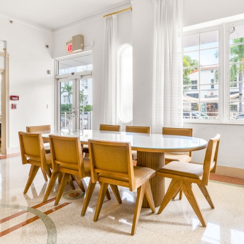 a room with a table and chairs