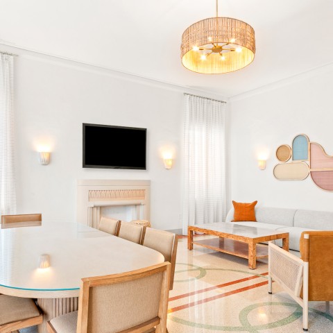 a room with a table and chairs