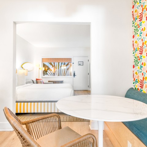 a room with a table and chairs