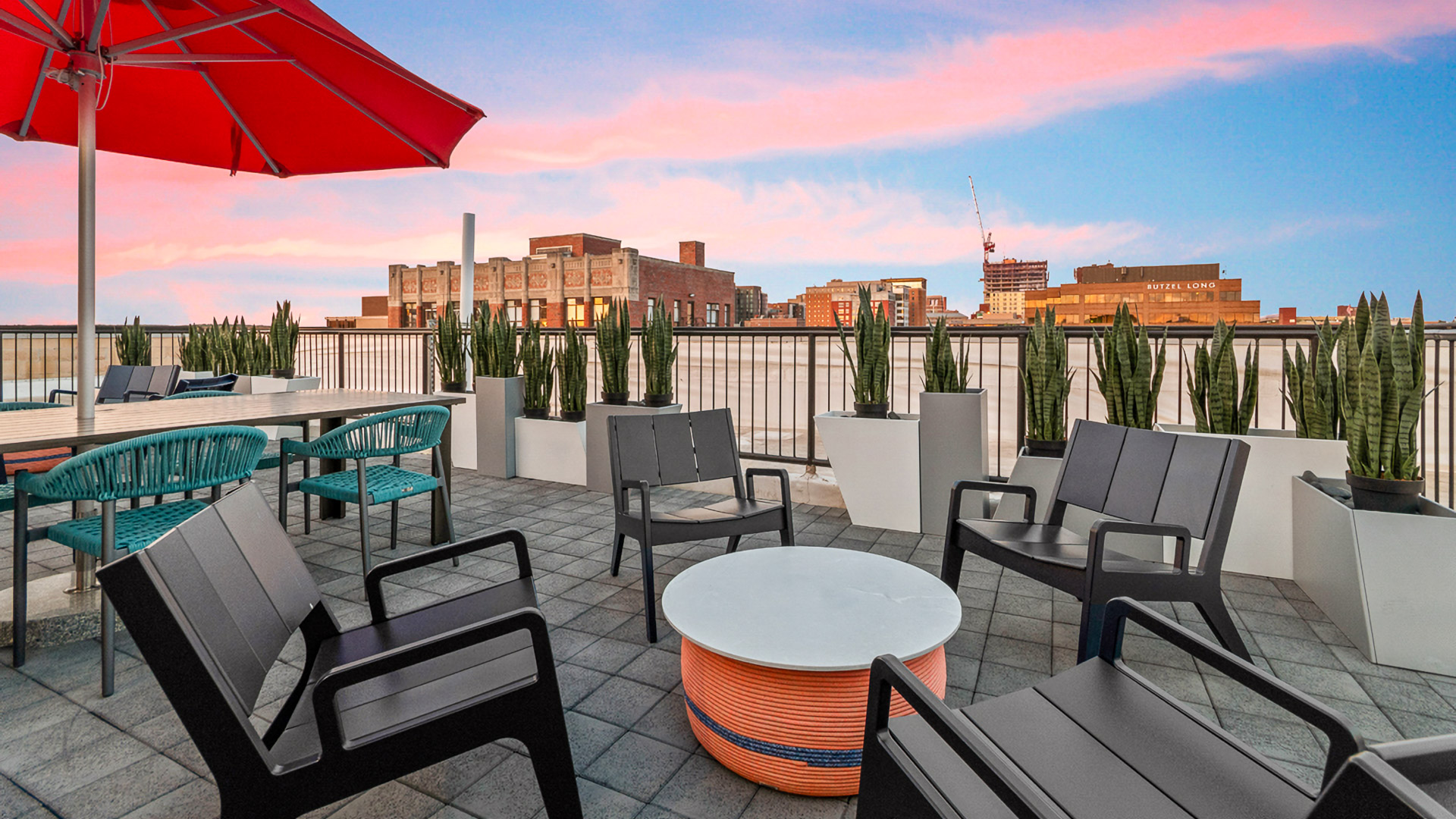 a patio with chairs and a table