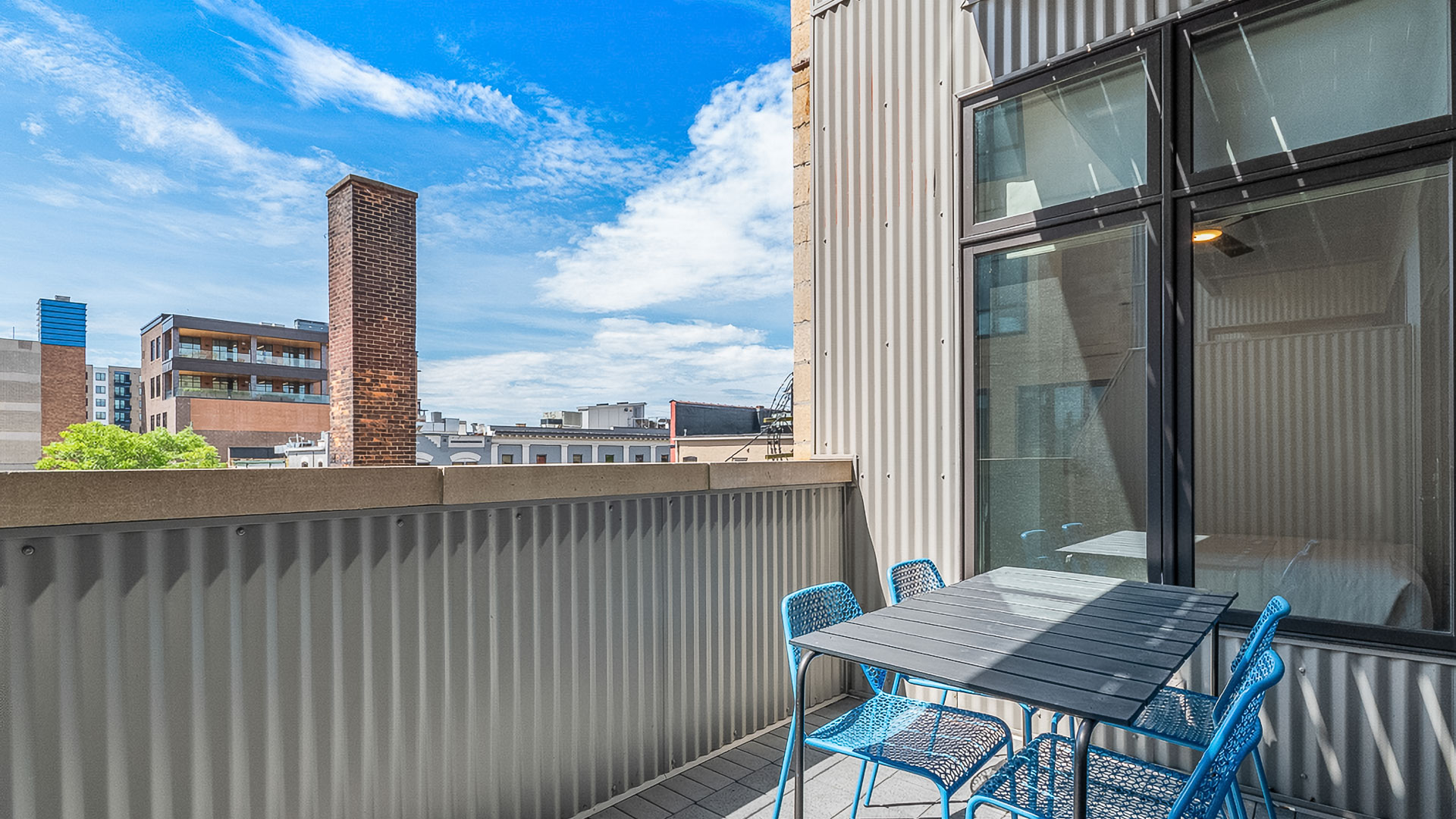 a table and chairs on a balcony