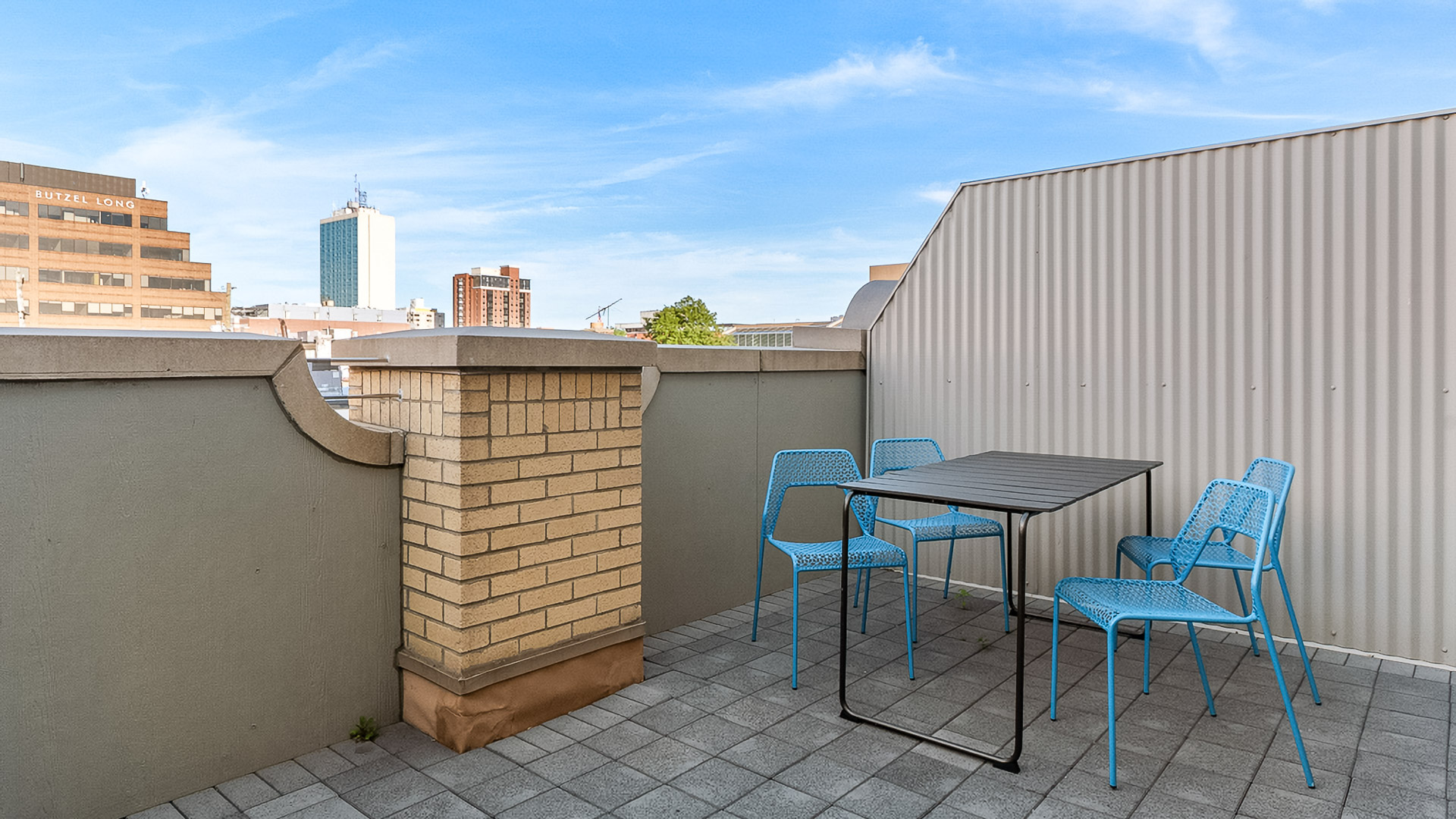 a table and chairs on a rooftop