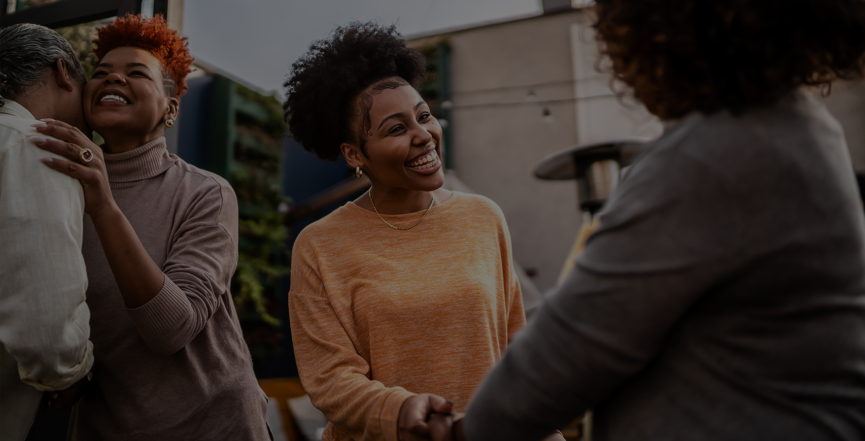 a woman shaking hands with another woman