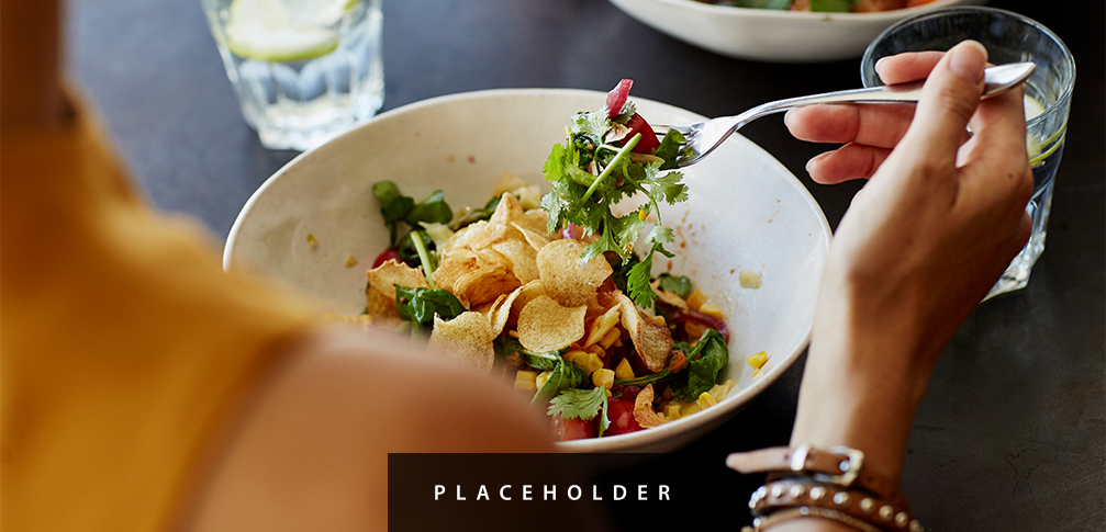 a person eating a salad
