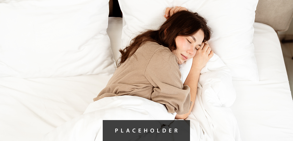 a woman sleeping in bed