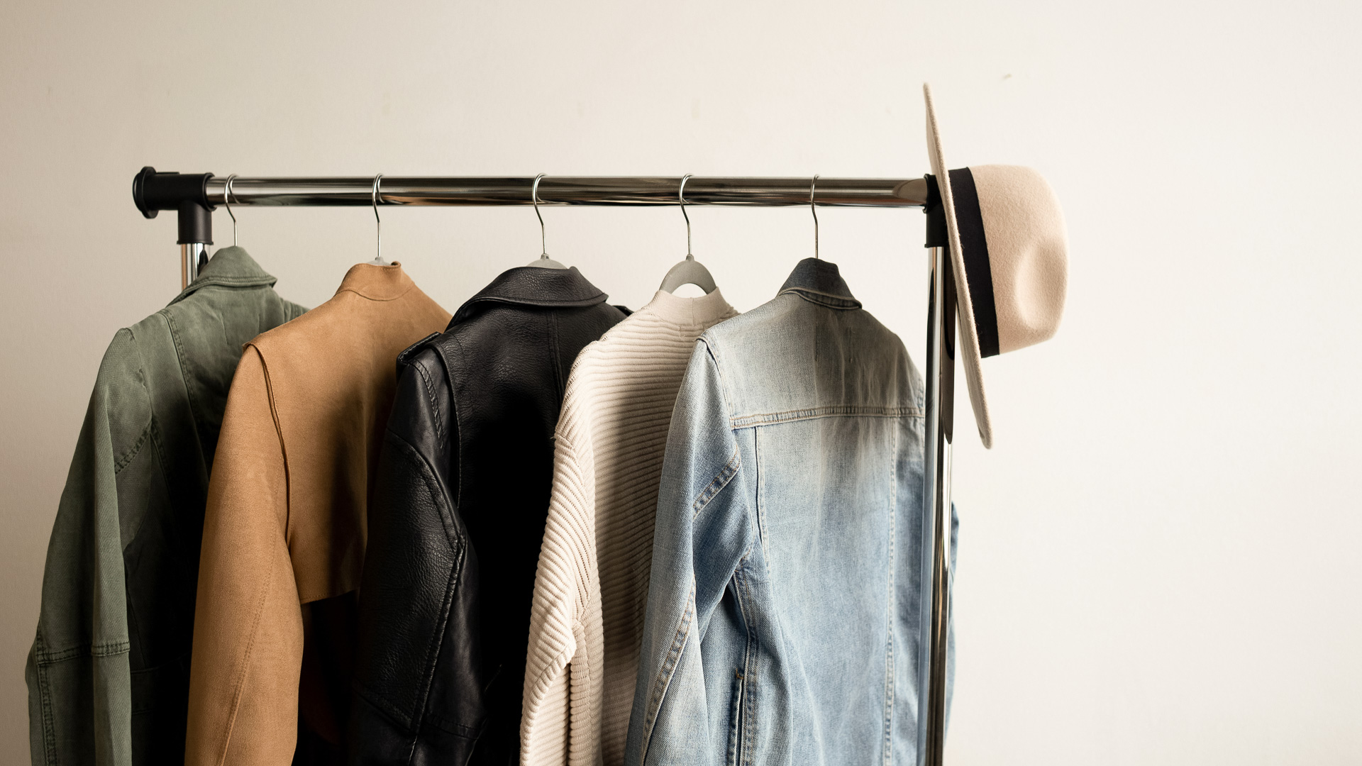 a rack with clothes and hat