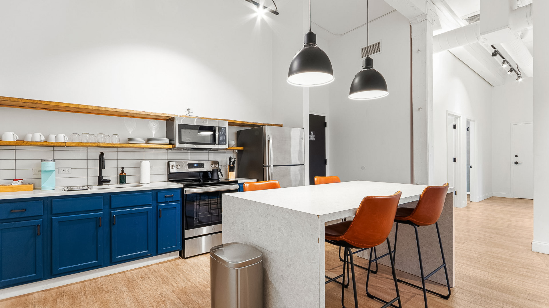 a kitchen with a table and chairs