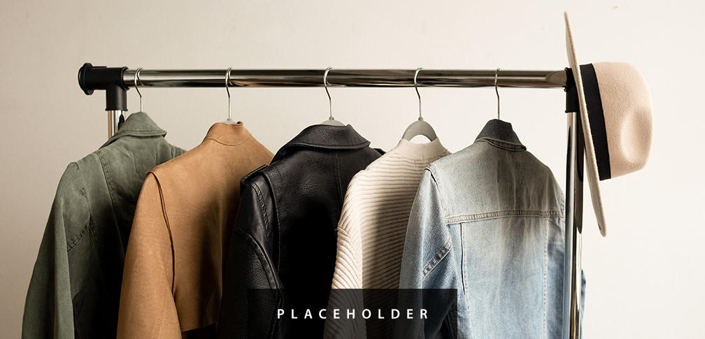 a row of jackets on a rack