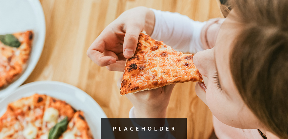 a person eating a slice of pizza