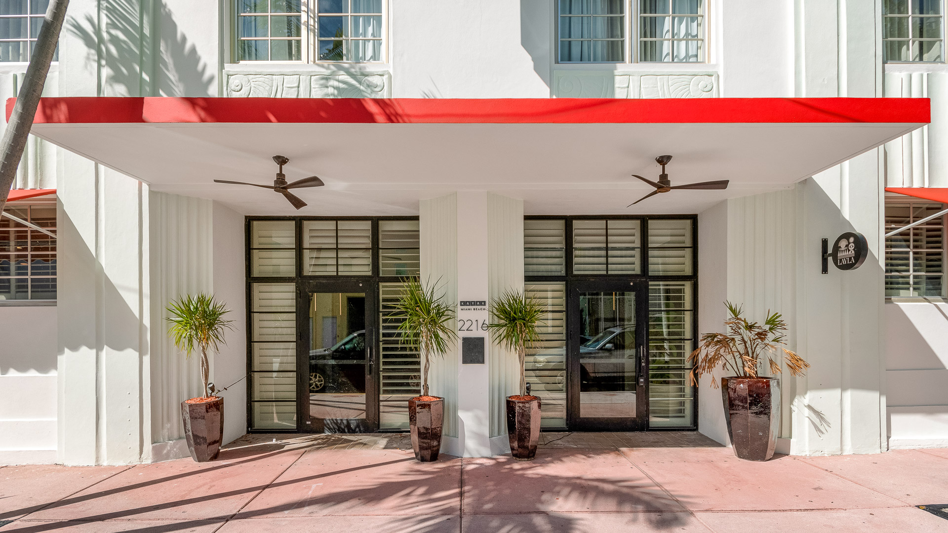 a building with plants in pots