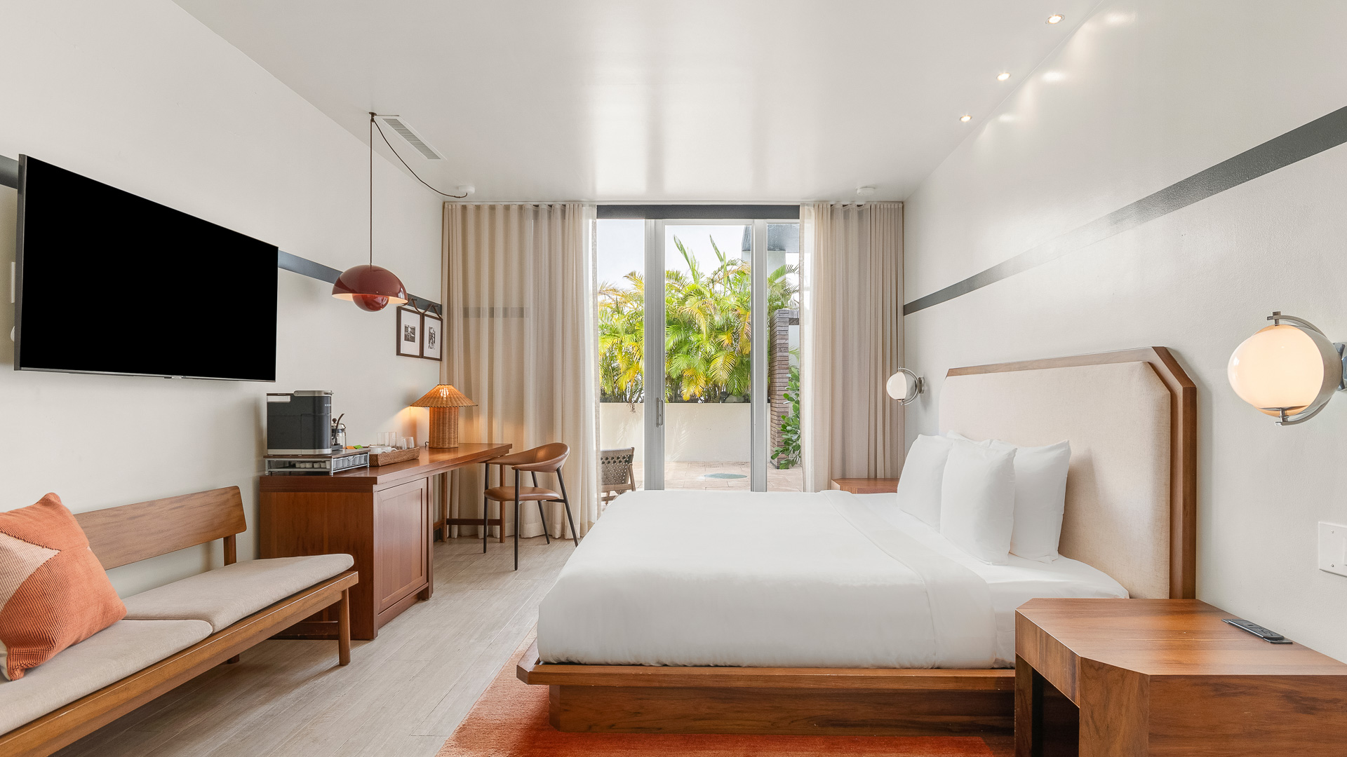 a room with a bed and desk and chair