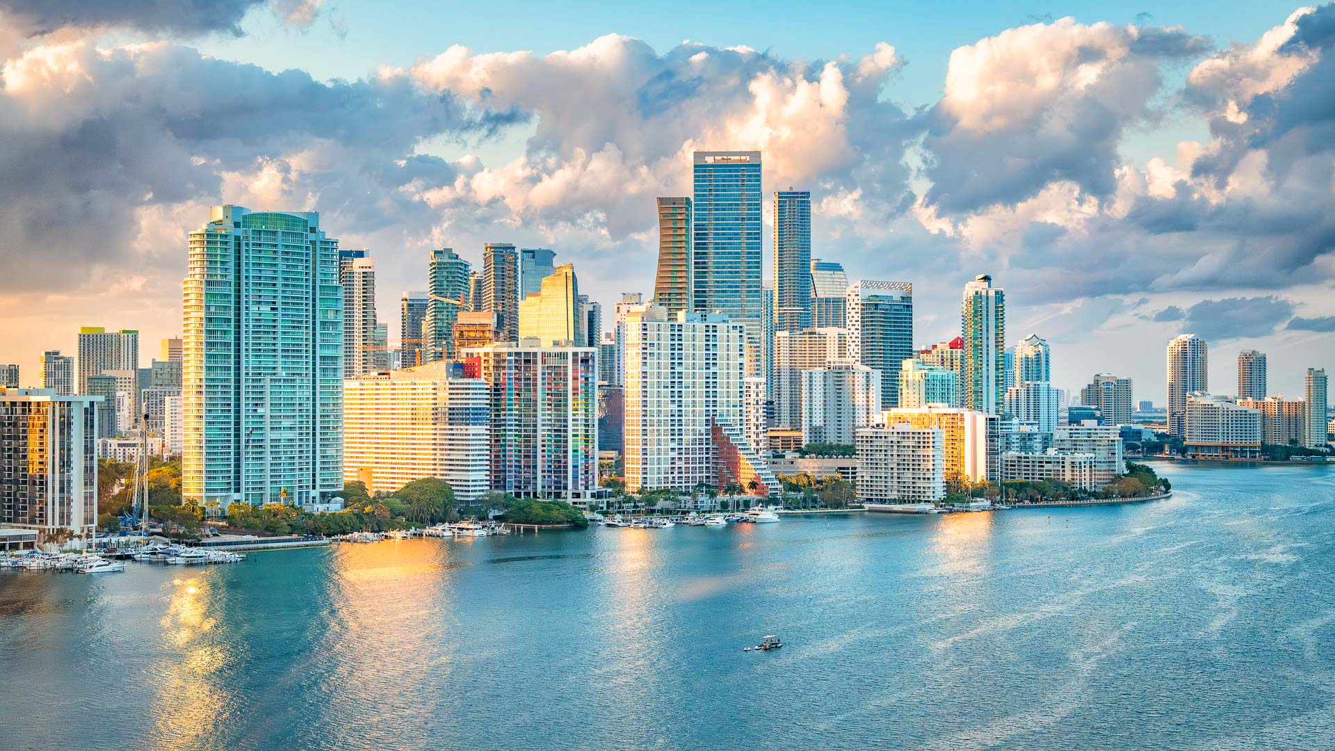 a city skyline with a body of water