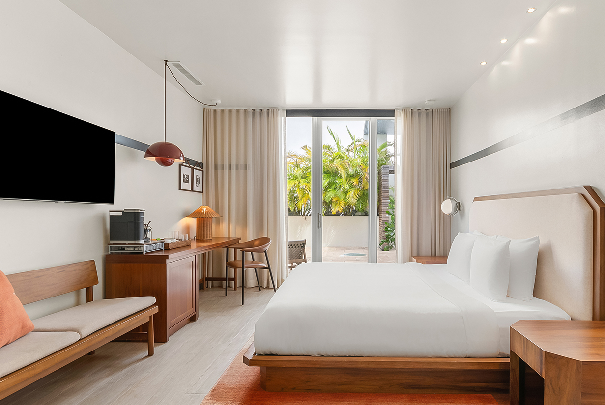 a bedroom with a bed and a desk