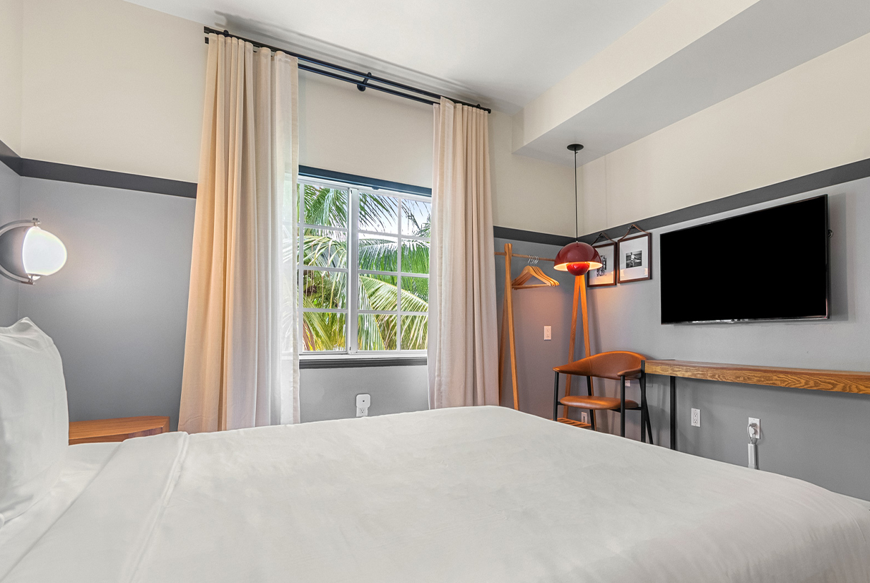 a room with a bed and a tv