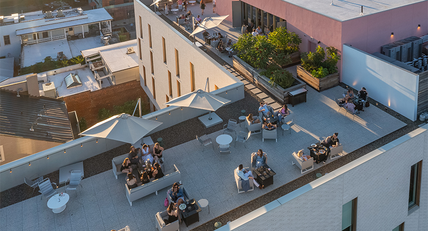 a group of people sitting on a patio